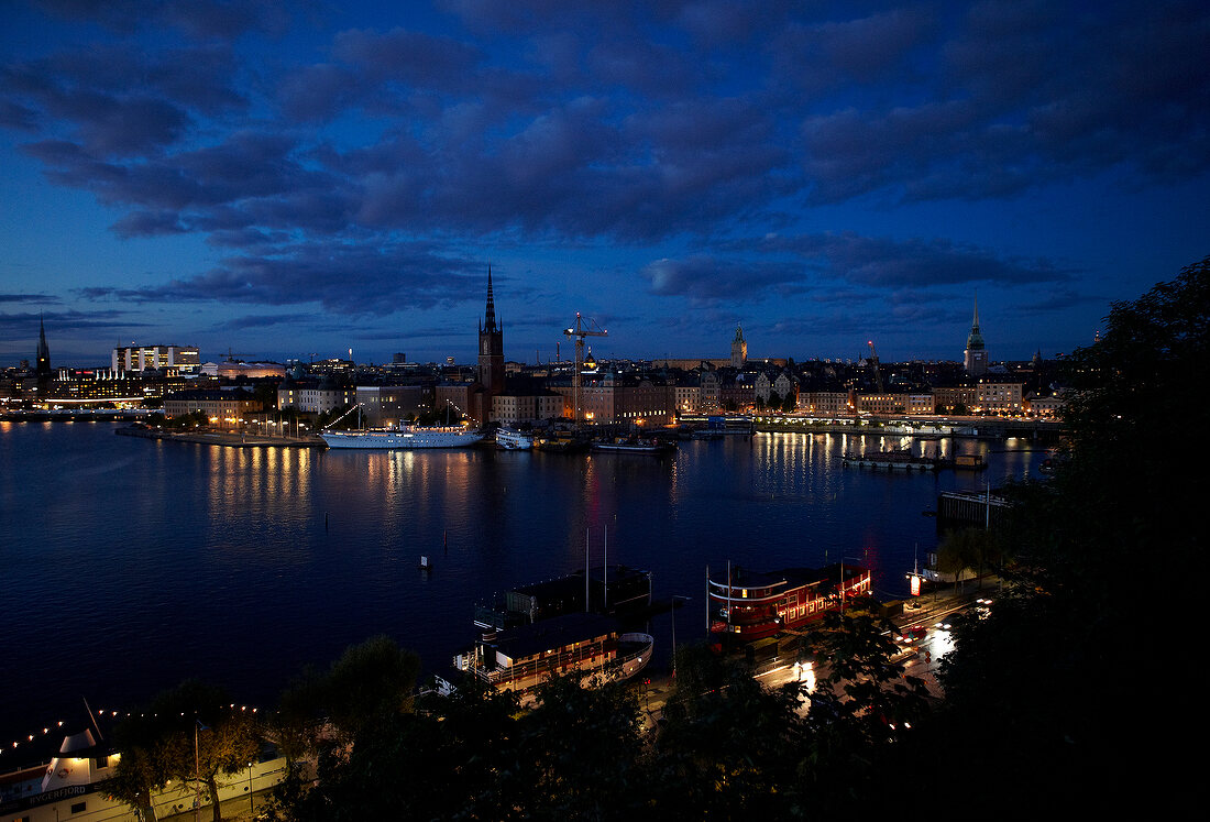 View of Stockholm cityscape at night with ships in Sweden