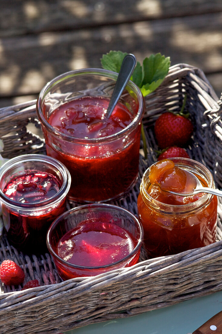 Four different homemade jams in jars