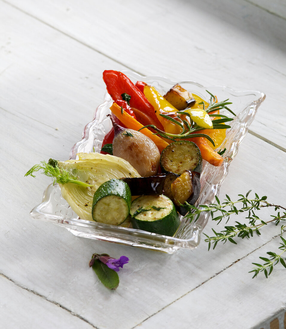 Antipasti vegetables with oil in serving bowl