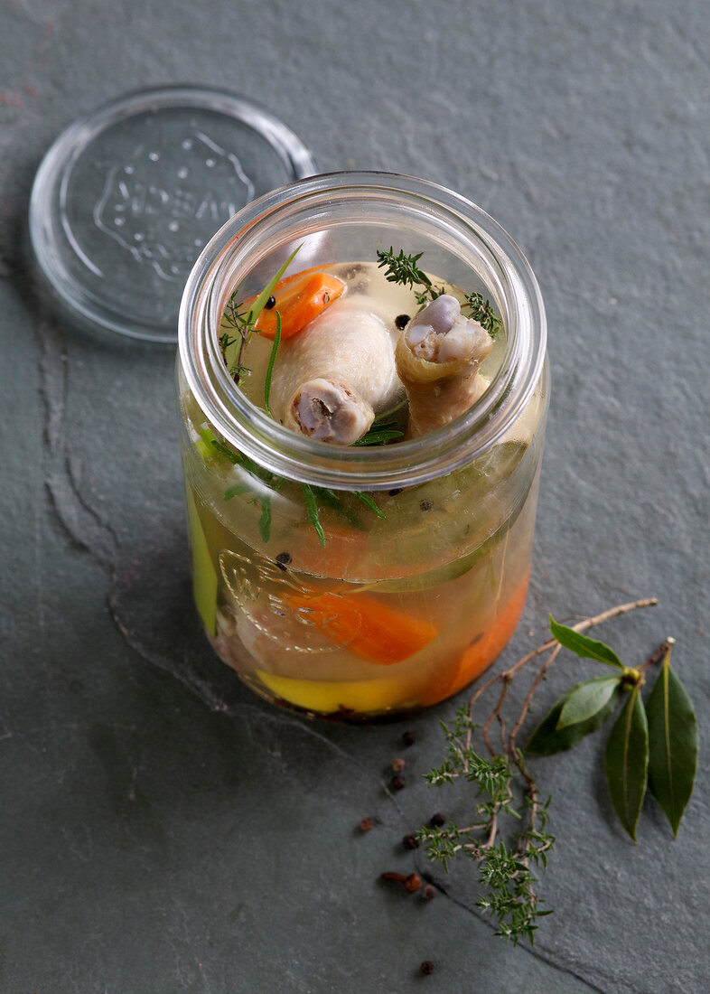Chicken with vegetables and broth in jar