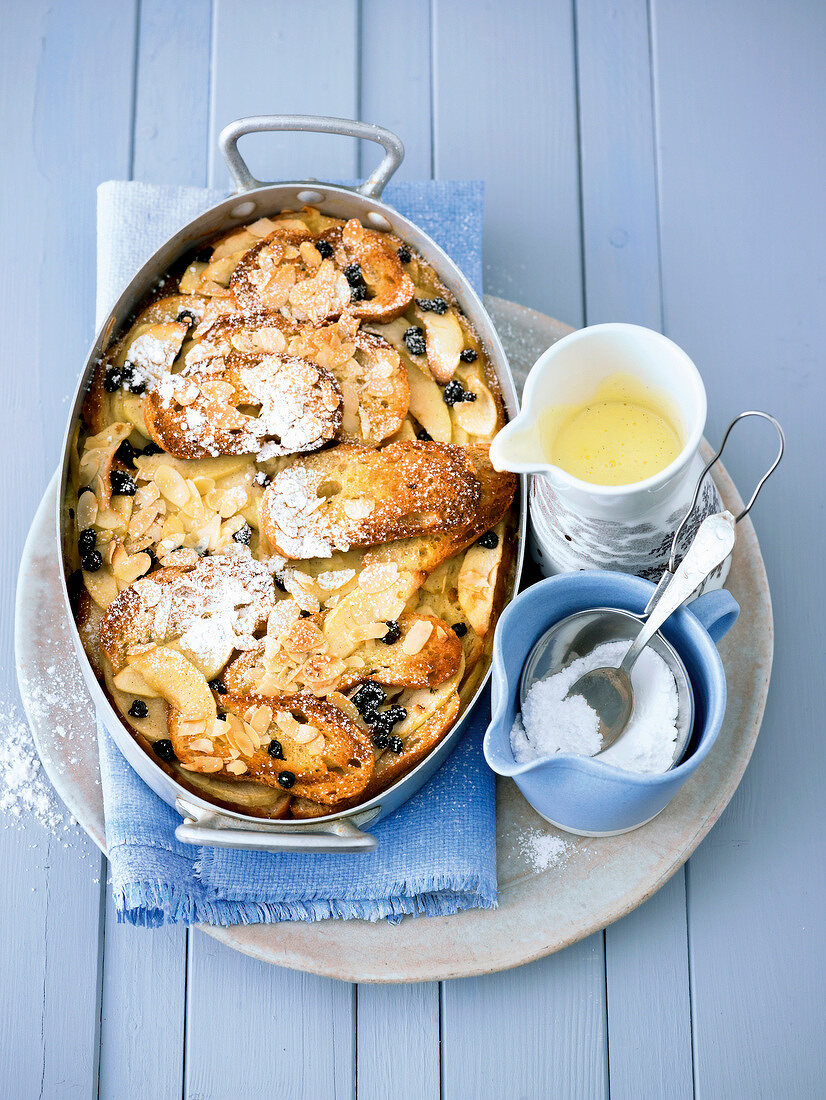 Ofenschlupfer with vanilla sauce in serving dish