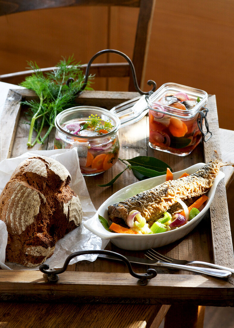 Three various dishes with herring on wooden tray