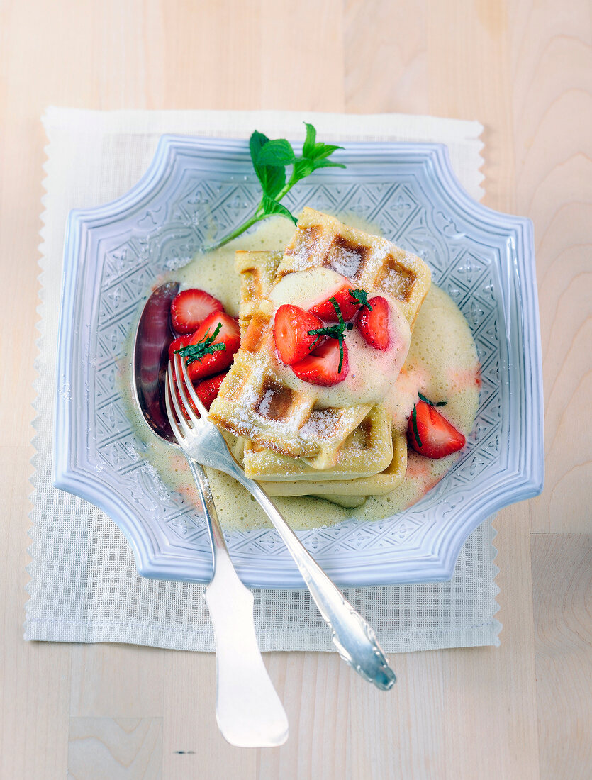 Nut waffles with strawberries and zabaglione n serving dish