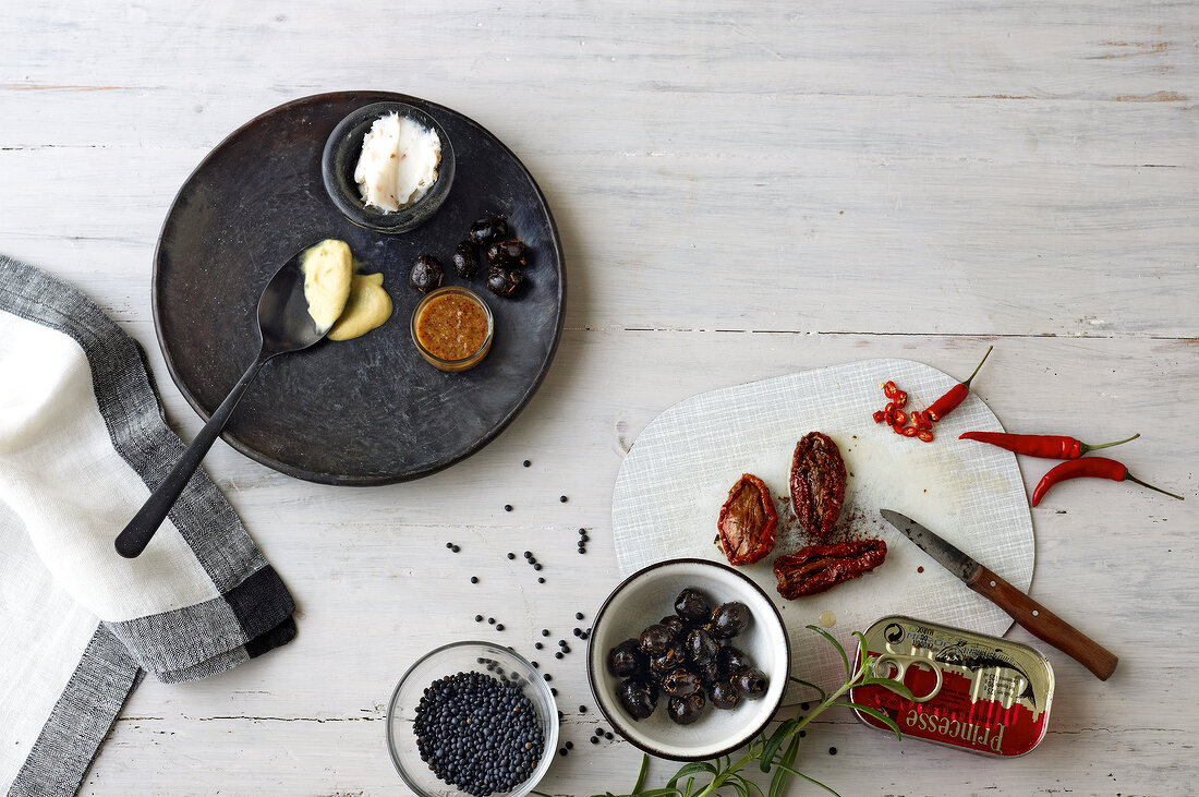 Various ingredients for special breads on plate and chopping board