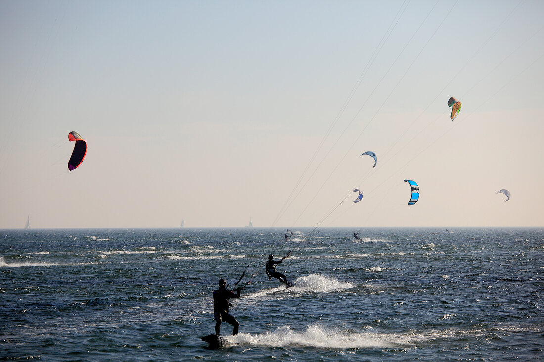 Kitesurfer doing kite surfing an Baltic Sea Coast in Fehmarn, Ostholstein, Germany 