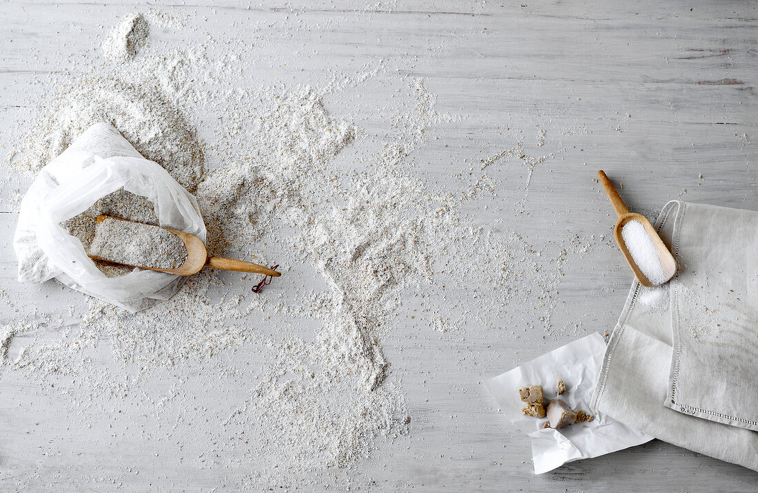 Flour and salt in spatula with yeast