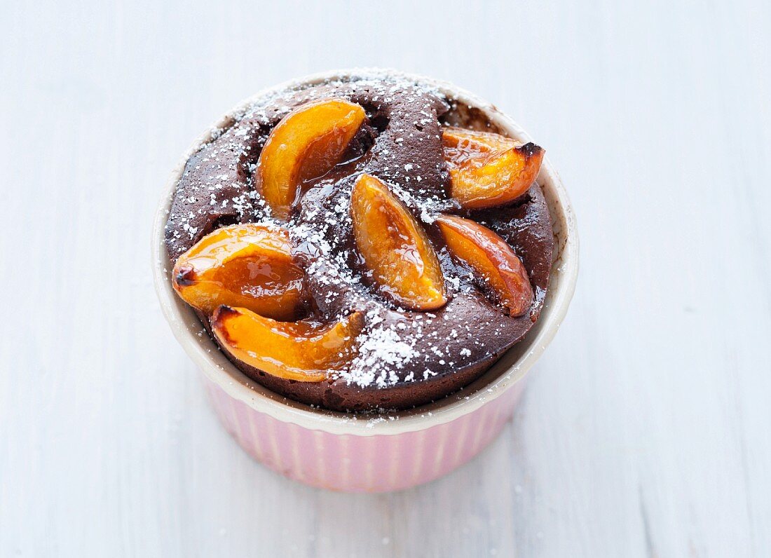 Chocolate and apricot cake baked in a souffle dish