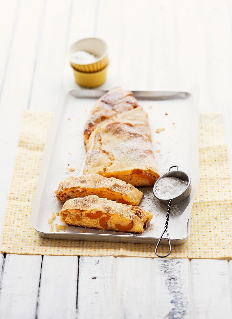 Apricot strudel with icing sugar