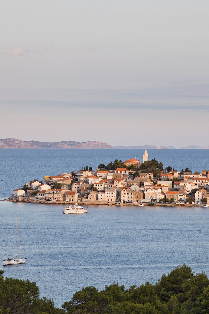 View of Primosten town and mountains on the horizon of Adriatic sea in Croatia