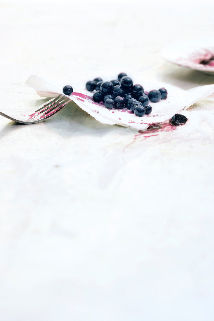 Crushed blueberries on kitchen napkin