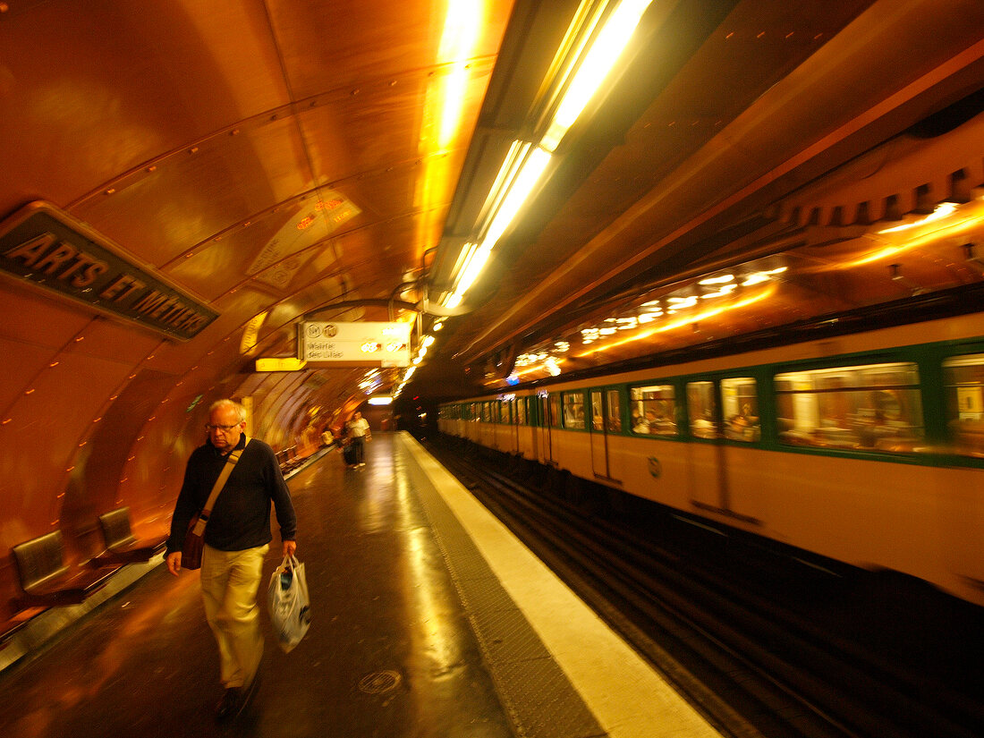 Senior woman waiting at Arts et Metiers metro station in Paris, France