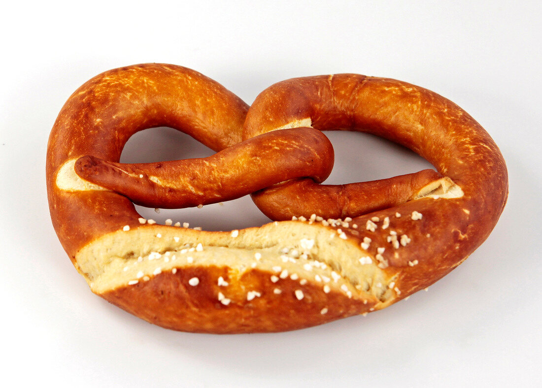 Whole grain pretzels on white background