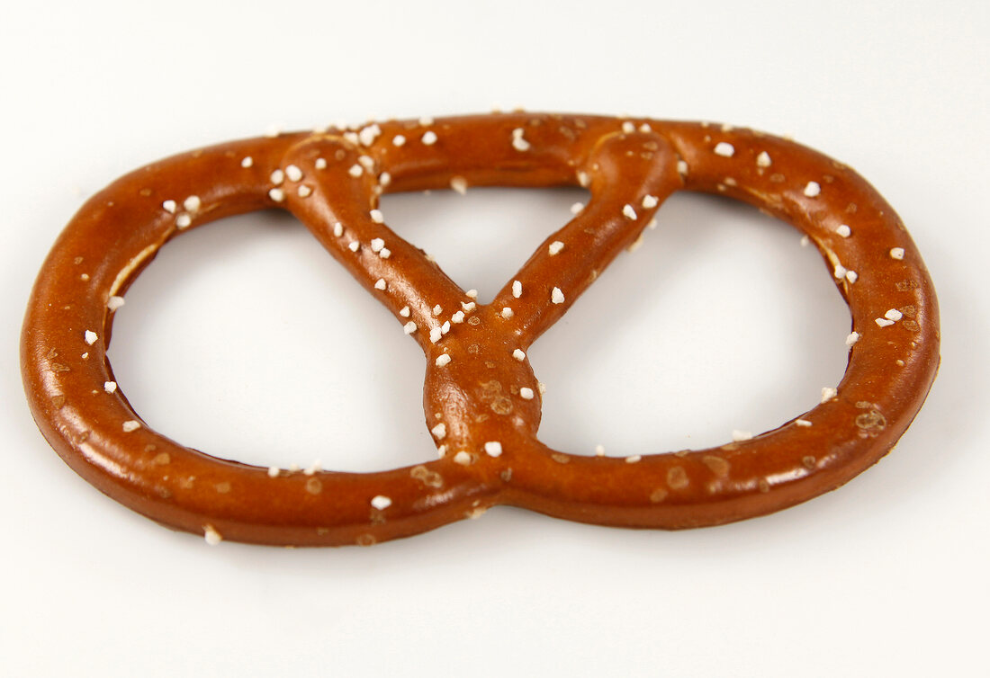 Pretzel cut at edge on white background