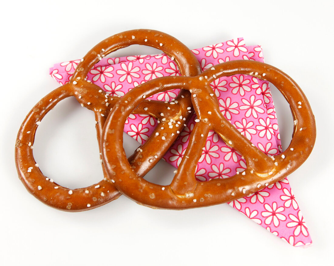 Two pretzels on floral pattern napkin