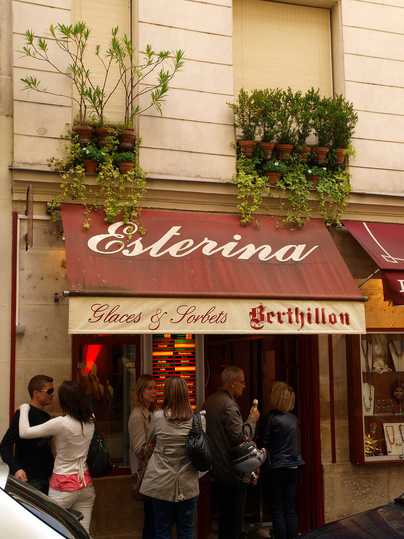 People standing outside Esterina ice cream shop, Paris, France