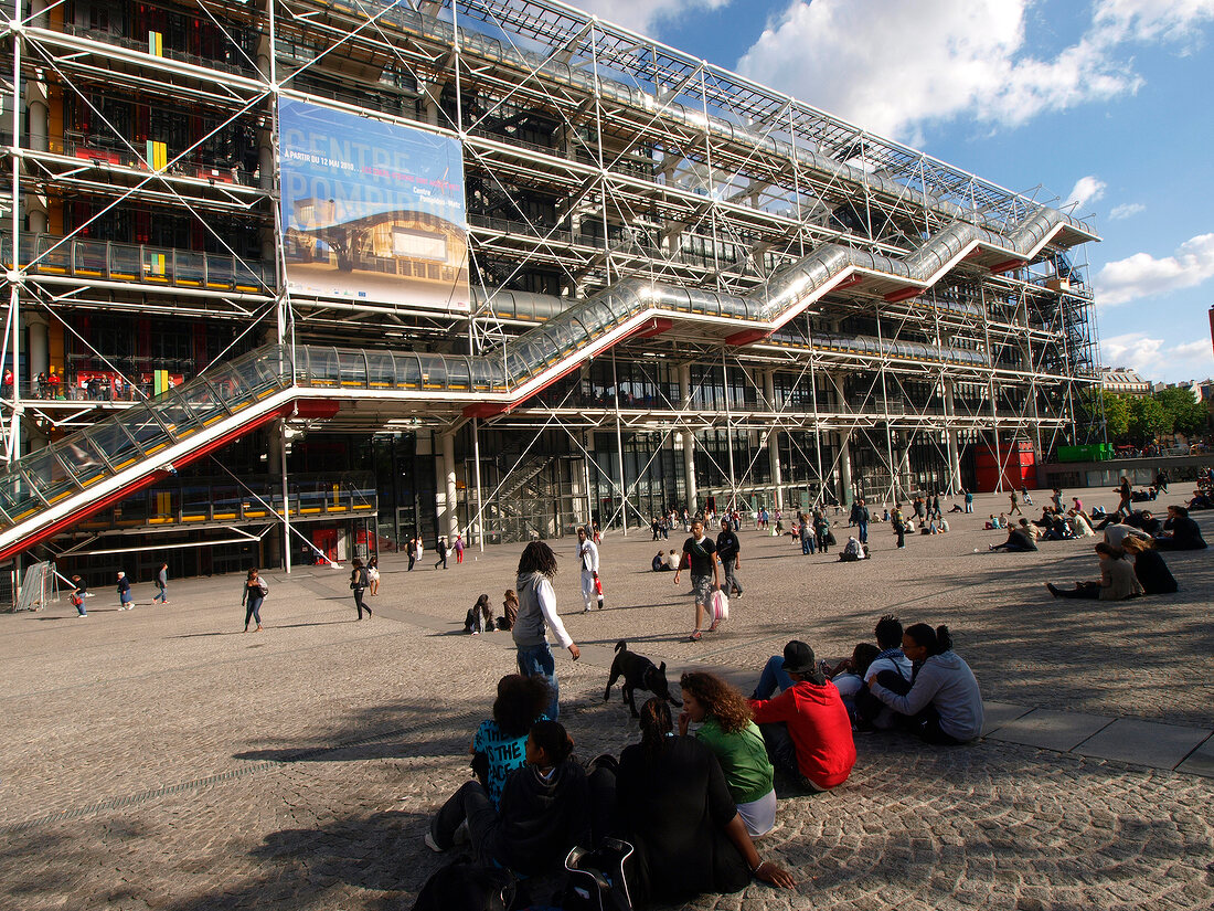 People sitting outside Centre Georges Pompidou Library in Paris, France