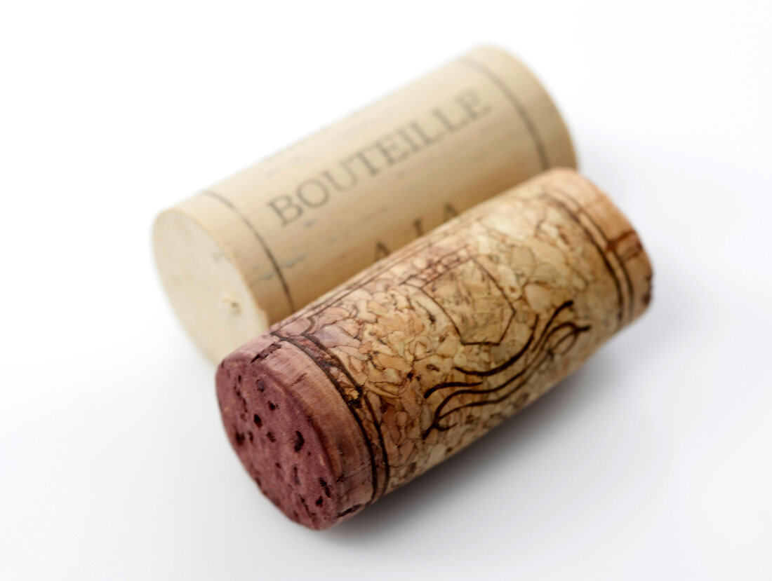 Close-up of two corks on white background