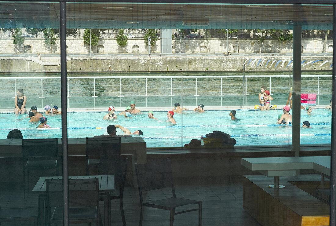 People at outdoor swimming pool on Seine river, Paris, France