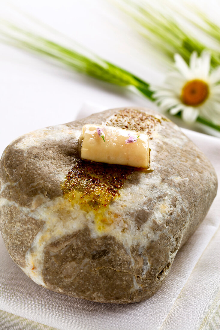 Close-up of stone with lardo and bacon