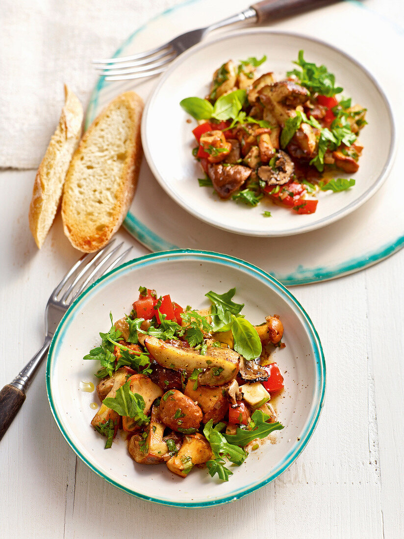 Tomato mozzarella salad with mushrooms on plate