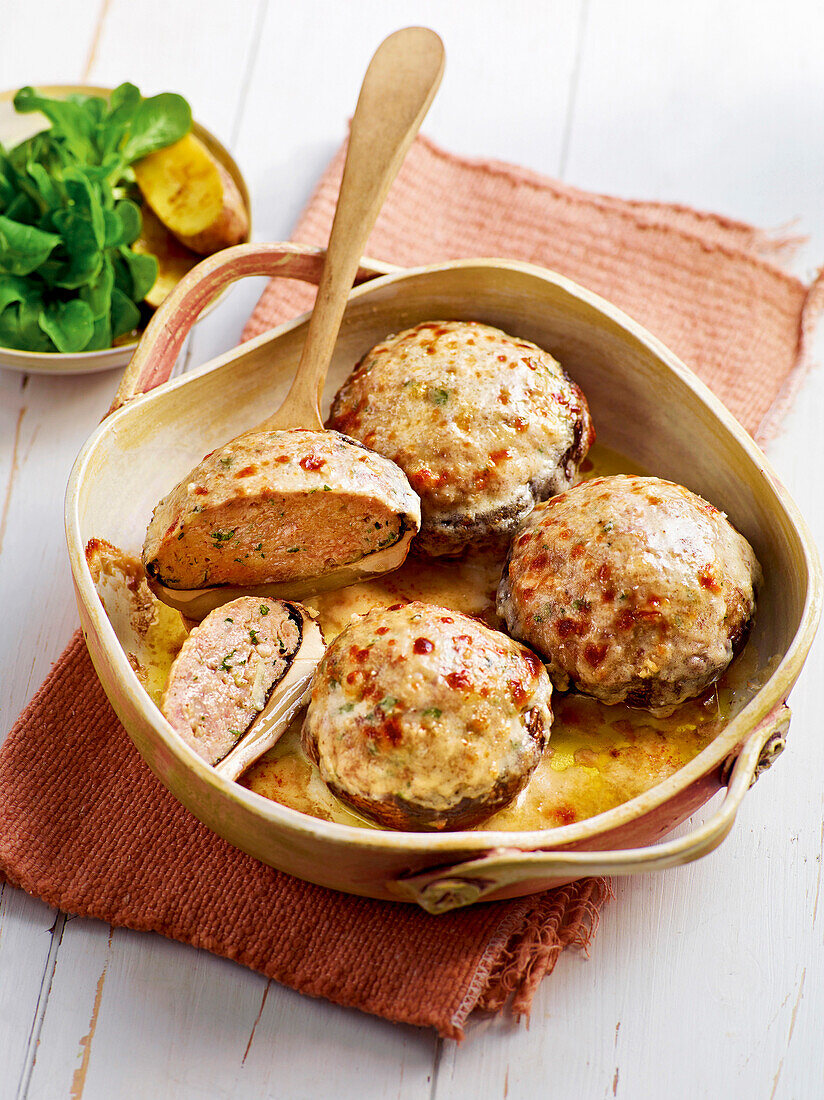 Portobello mushrooms stuffed with minced meat in casserole