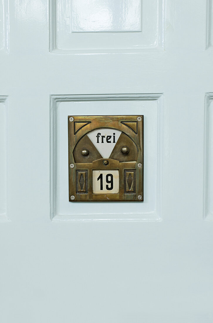 Close-up of room occupancy shield on door, Sprudelhof, Bad Nauheim, Gremany