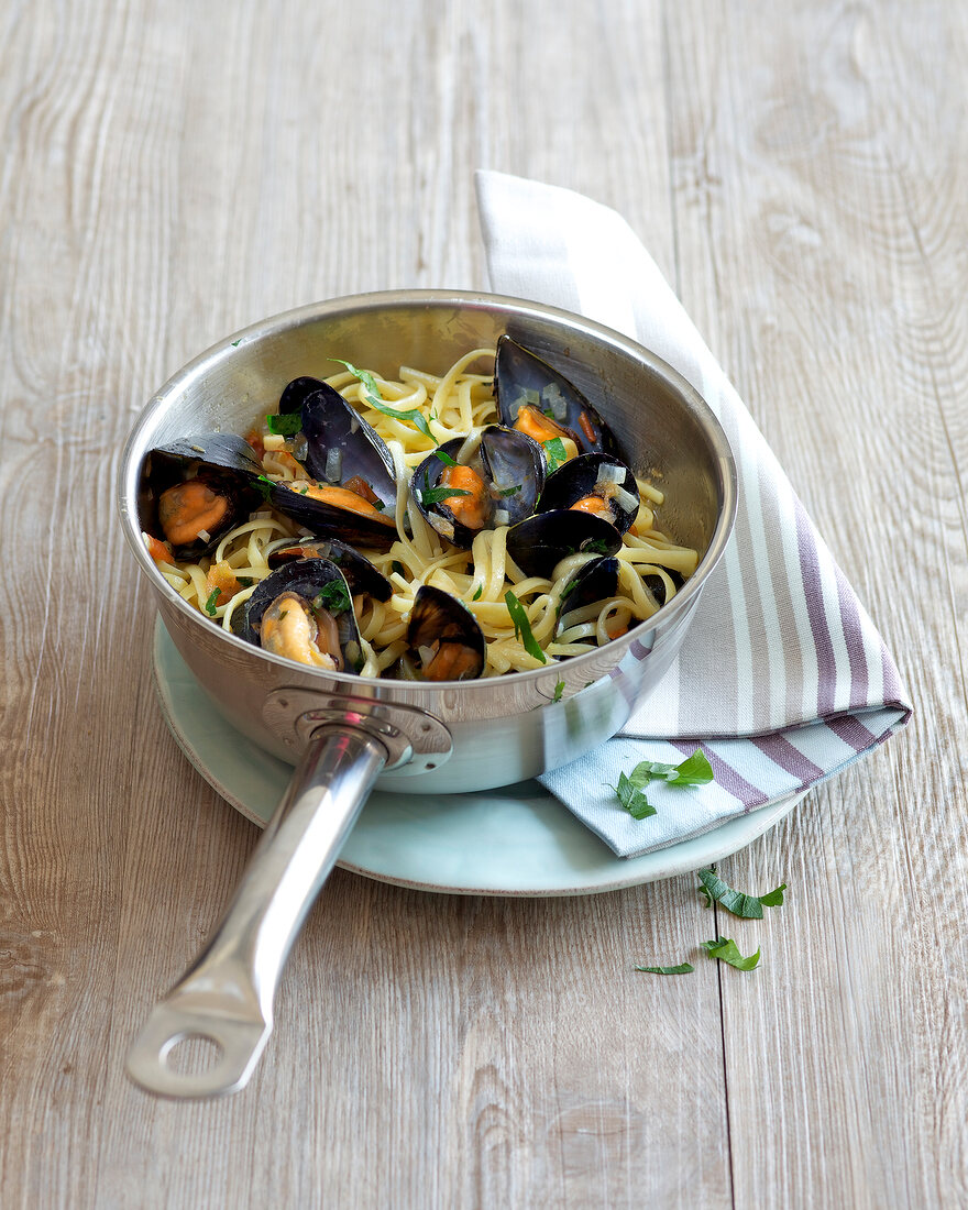 Clam linguine in steel pan