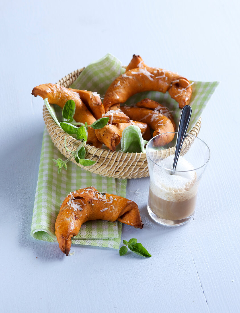 Ham croissants in basket and on napkin