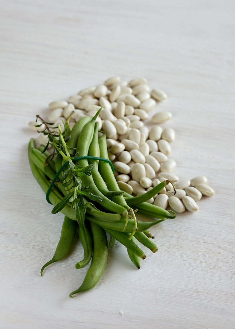 Green and white broad beans on plate