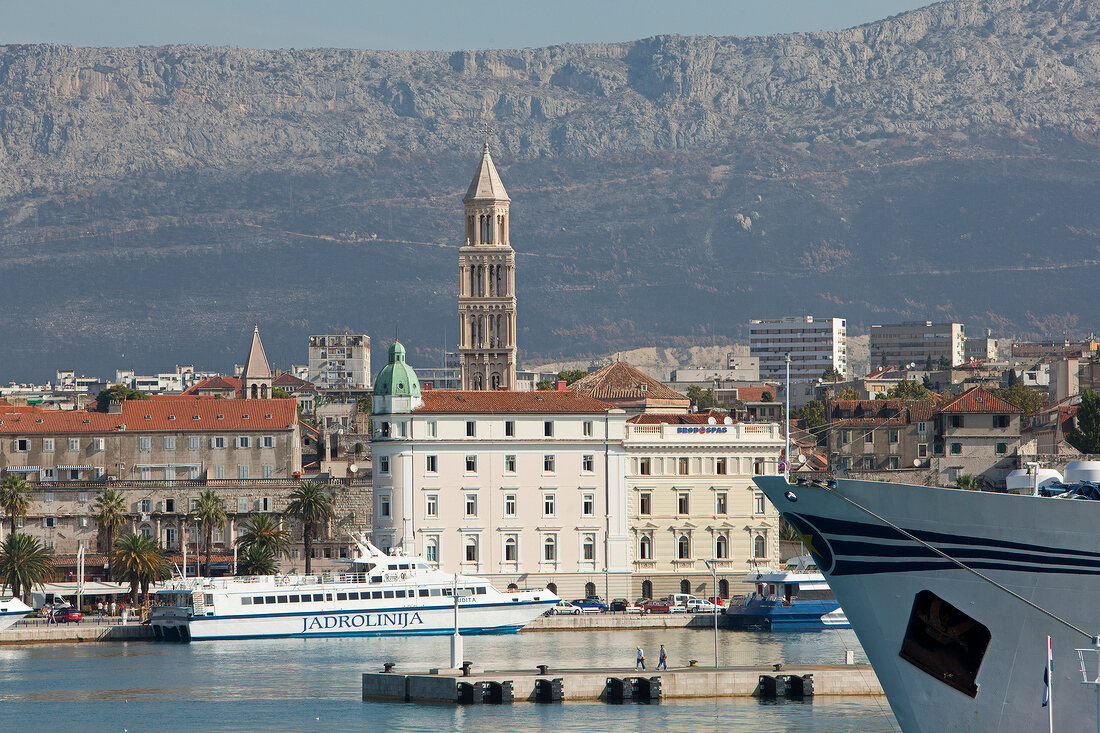 View of old town and ferry in Adriatic sea, Dalmatia, Croatia