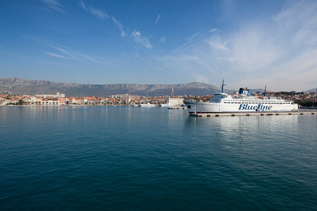 View of old town and ferry in Adriatic sea, Dalmatia, Croatia