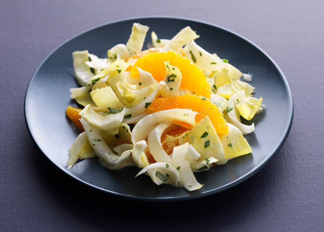 Endive and orange salad on plate