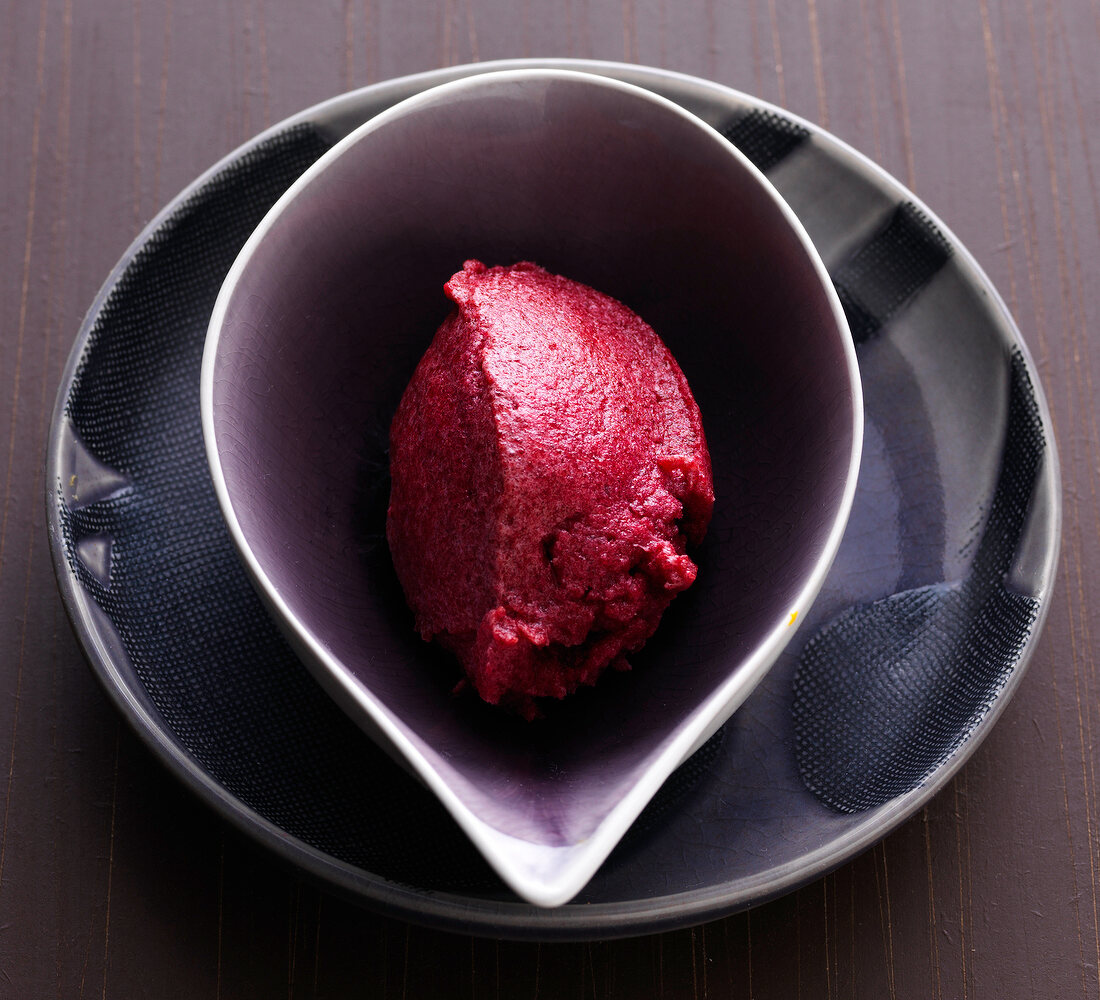 Beetroot and blackcurrant sorbet in serving bowl