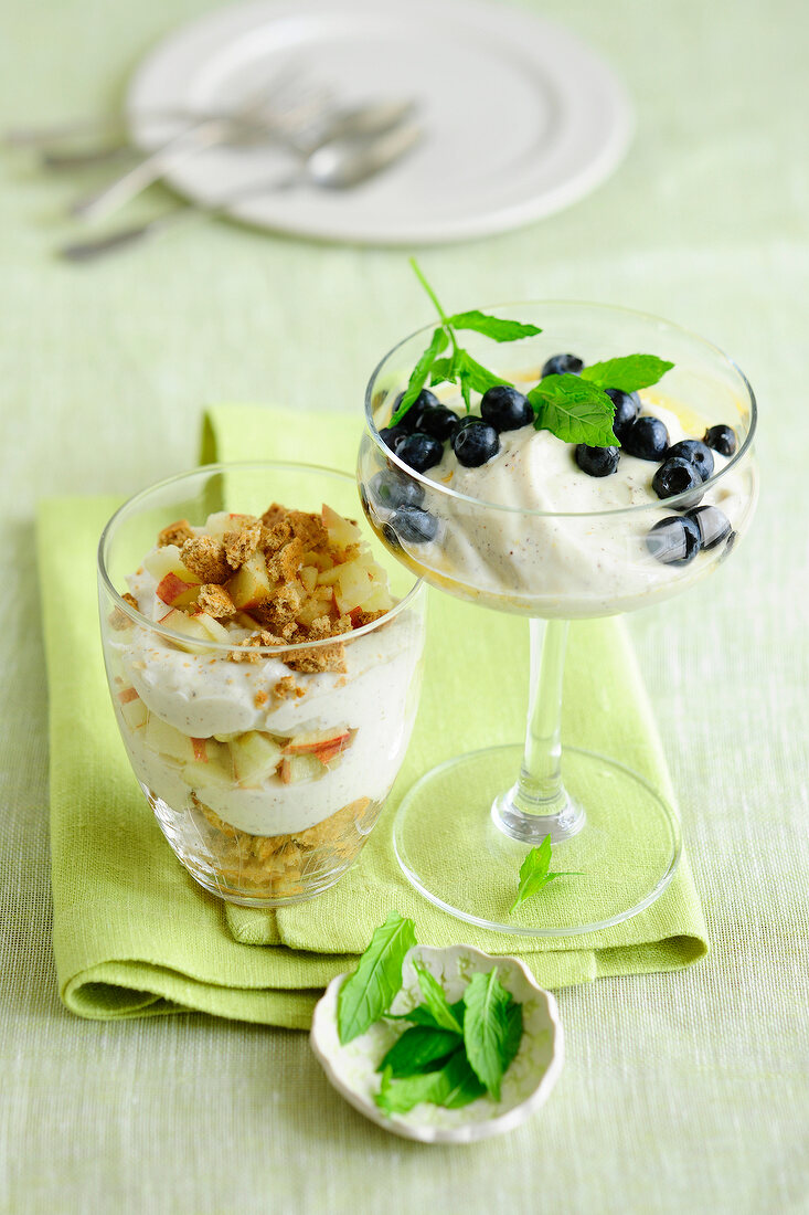 Two glasses of blueberry quark dessert and apple tiramisu, low GI diet food