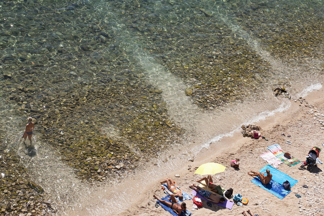 Kvarner Bay and people relaxing on beach, Croatia