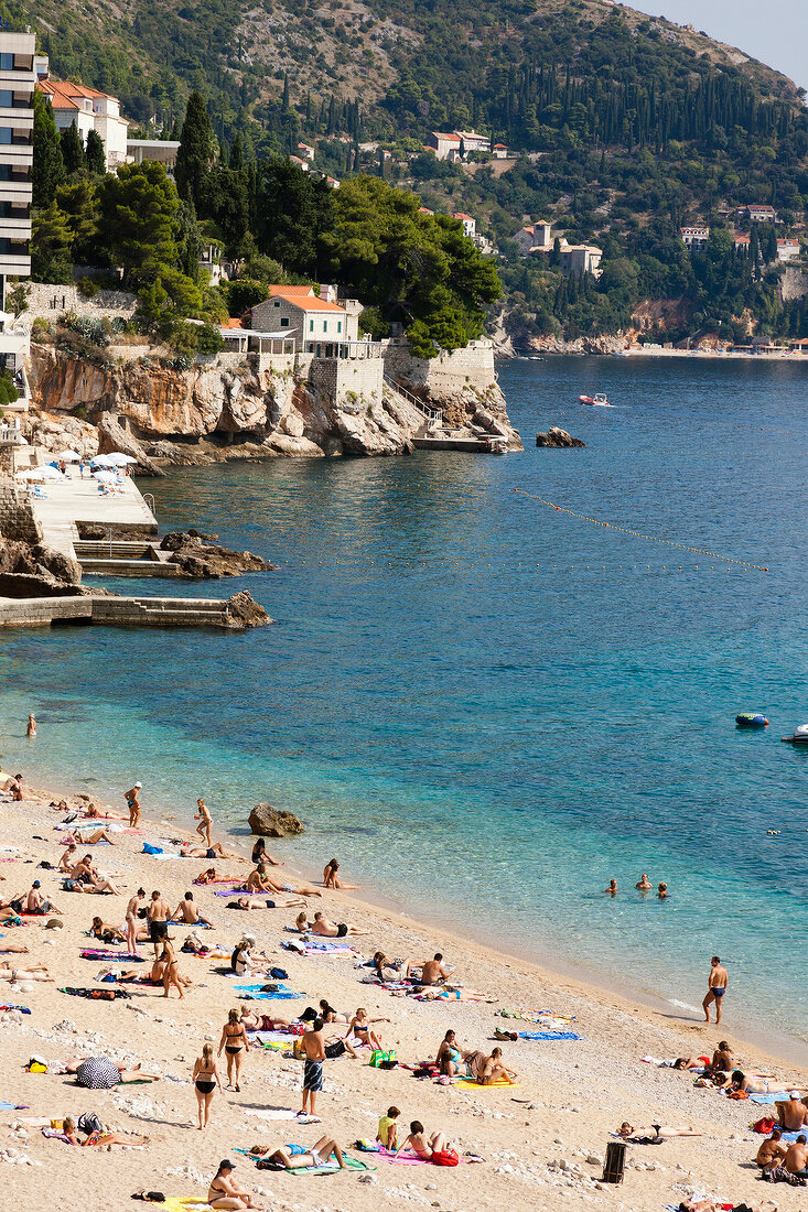 People relaxing on beach Banje, Dubrovnik, Croatia