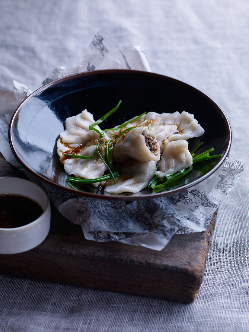 Filled dumplings in serving bowl