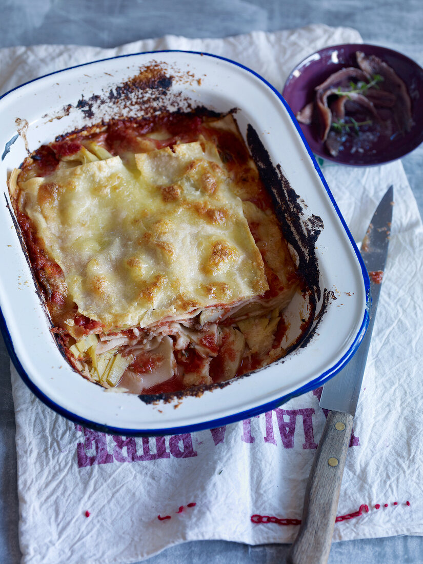 Tomato lasagne with anchovy in serving dish