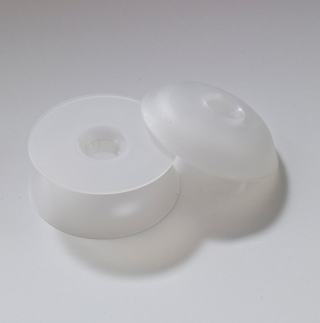 White plastic roll coil for wool on white background