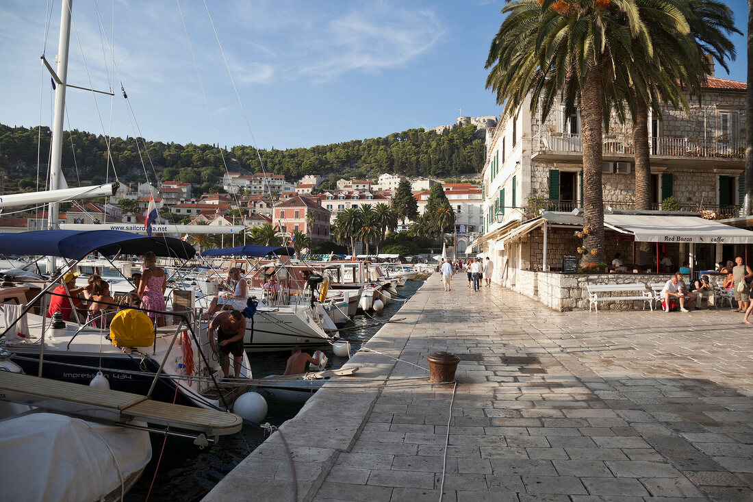 Tourists at Hvar harbour waterfront in Croatia