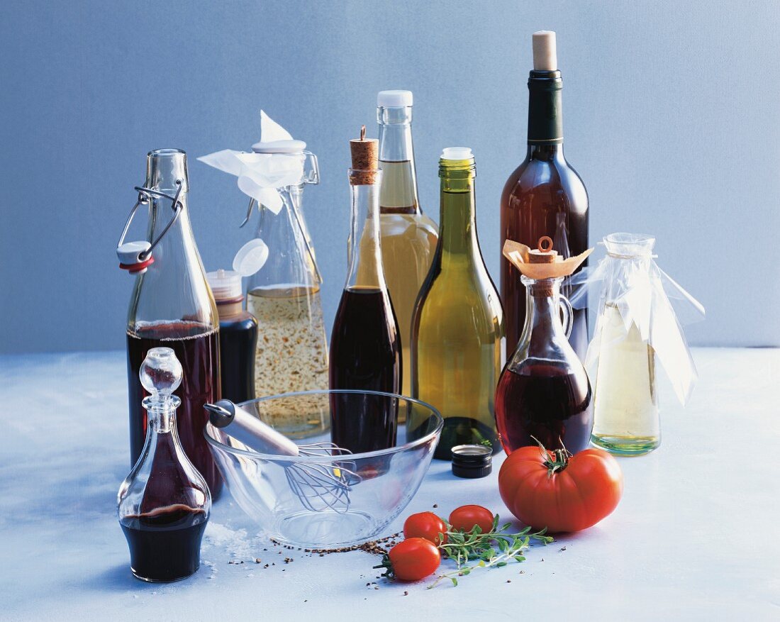 An arrangement of various types of vinegar in bottles