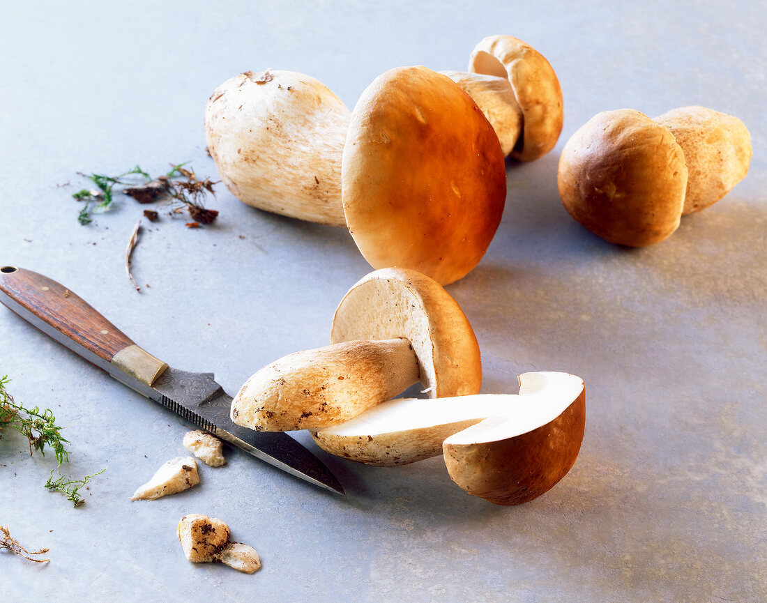 Whole and halved porcini mushrooms