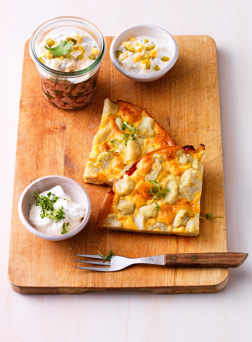 Cauliflower frittata with Jellied ham in glass on wooden board
