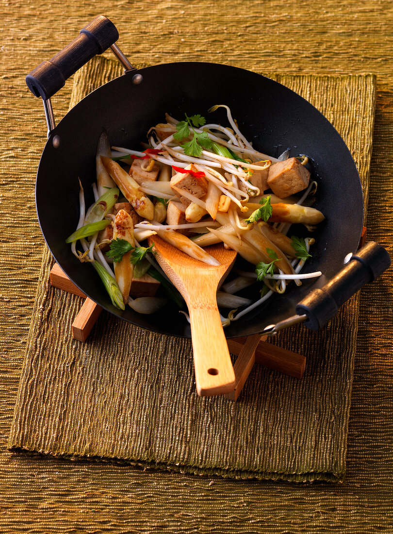 Stir-fry with tofu and asparagus in frying dish