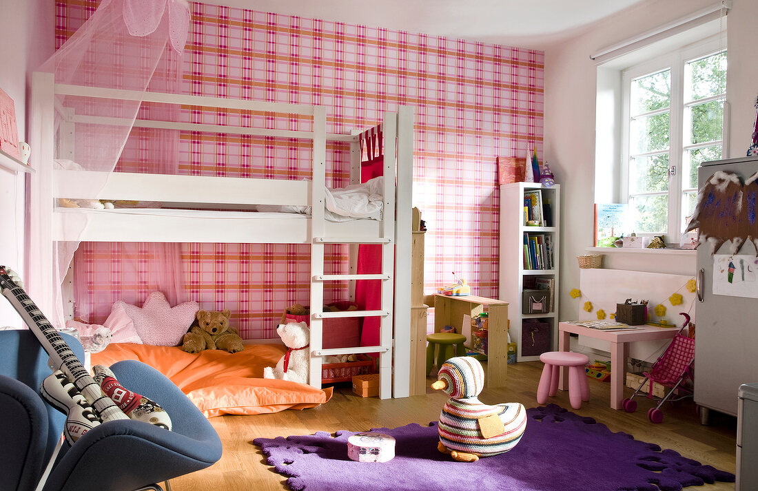Children's room with bunk bed, carpet and pink wallpaper