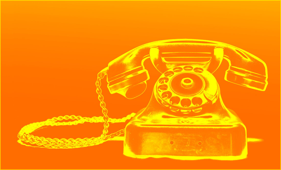 Illustration of old rotary phone against orange background