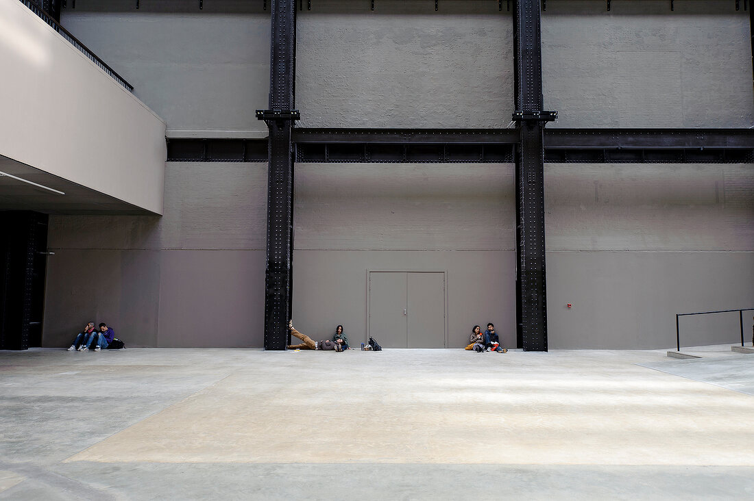 People relaxing in Tate gallery of modern art, Southwark, London, UK