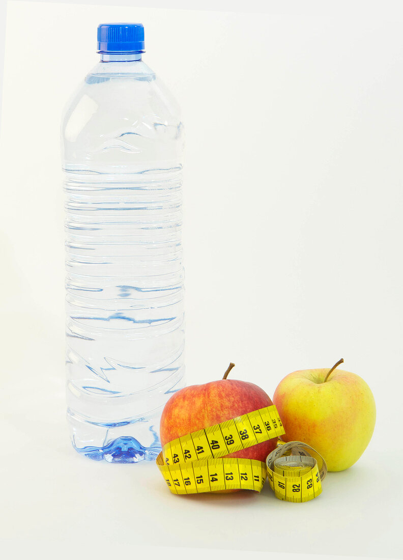 Water bottle and measuring tape around apples on white background, Icon image for diet
