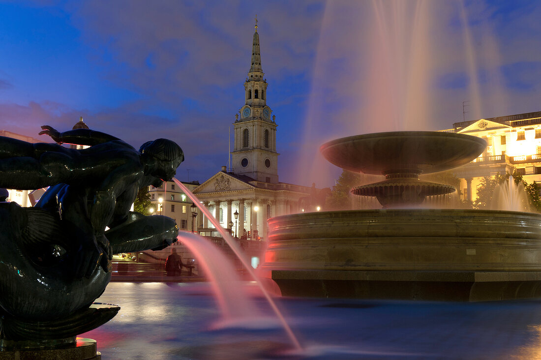 Fountains at Trafalgar Square and St Martin-in-the-Fields in background at London, UK