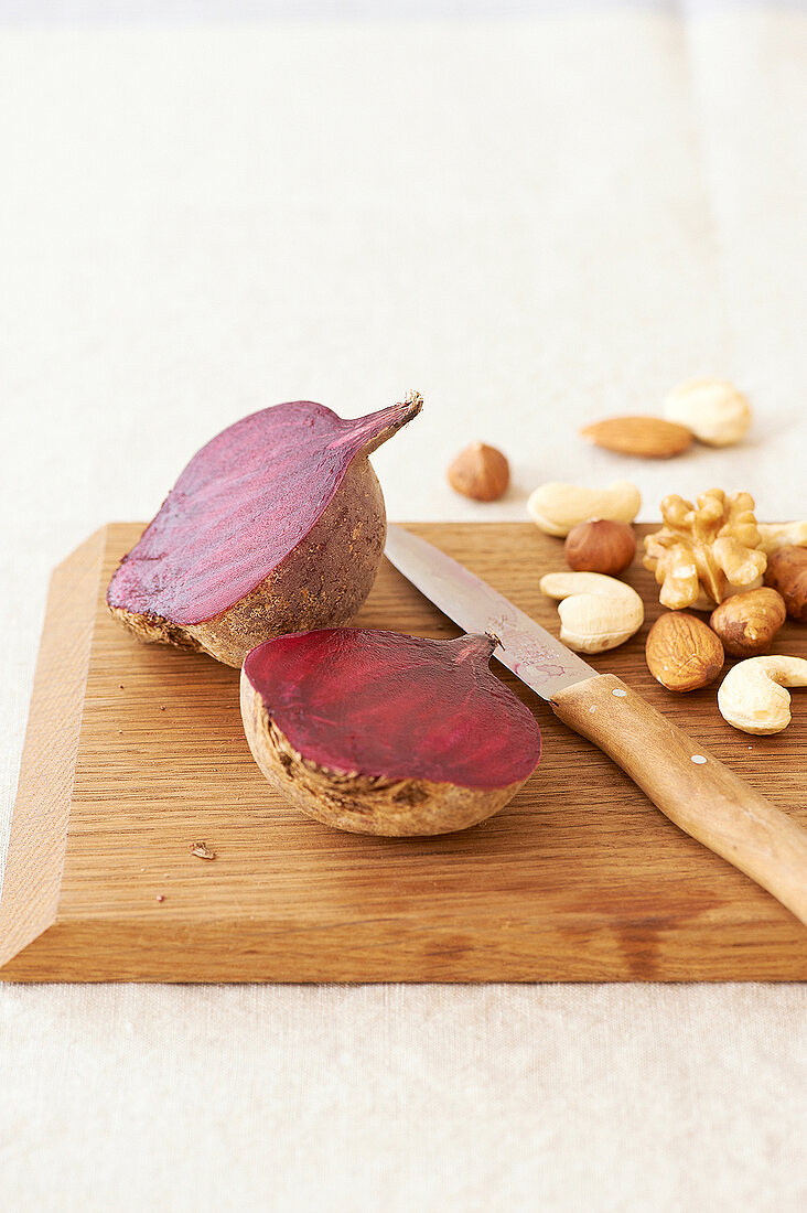 Beetroot and nuts on wooden board